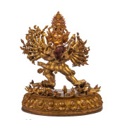 A BRONZE-GILT FIGURE OF BUDDHA