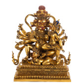 A BRONZE-GILT FIGURE OF BUDDHA