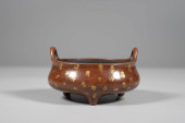 A BRONZE 'GOLD-SPLASHED' BRIDG