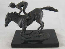 A bronze group of a racehorse