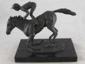 A bronze group of a racehorse