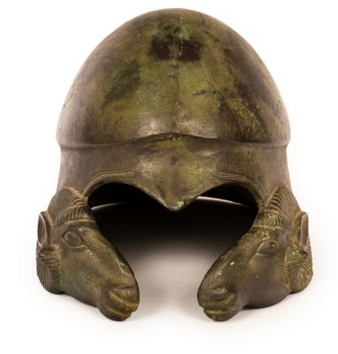 A bronze helmet, after the antique,