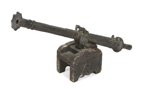 * A Bronze Iron Cannon of typical