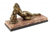 A BRONZE MODEL OF A RECLINING