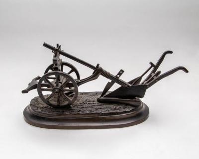 A bronze model of a plough, 19th