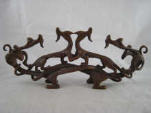 A bronze of four intertwined