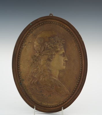 A Bronze Oval Portrait Plaque