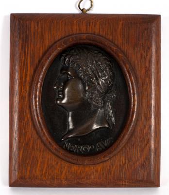 A bronze portrait plaque