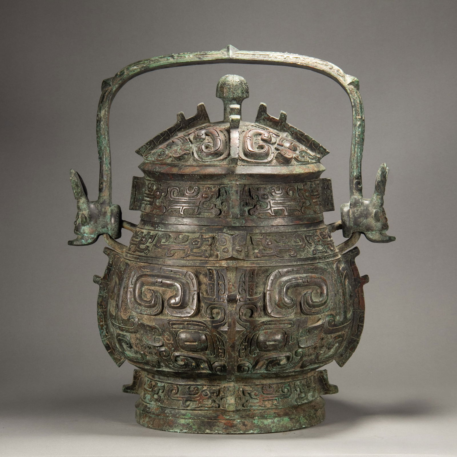 A BRONZE RITUAL WINE VESSEL AND