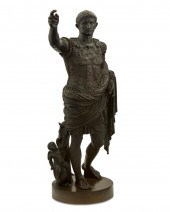 A BRONZE SCULPTURE DEPICTING T