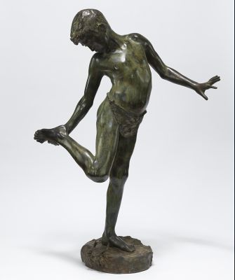 A Bronze Sculpture of a Boy and a