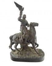 A BRONZE SCULPTURE OF A FALCON
