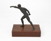 A BRONZE SCULPTURE OF AN ATHLE