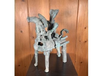 A bronze sculpture of figure on