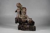 A BRONZE 'SEATED SAKYAMUNI' ST