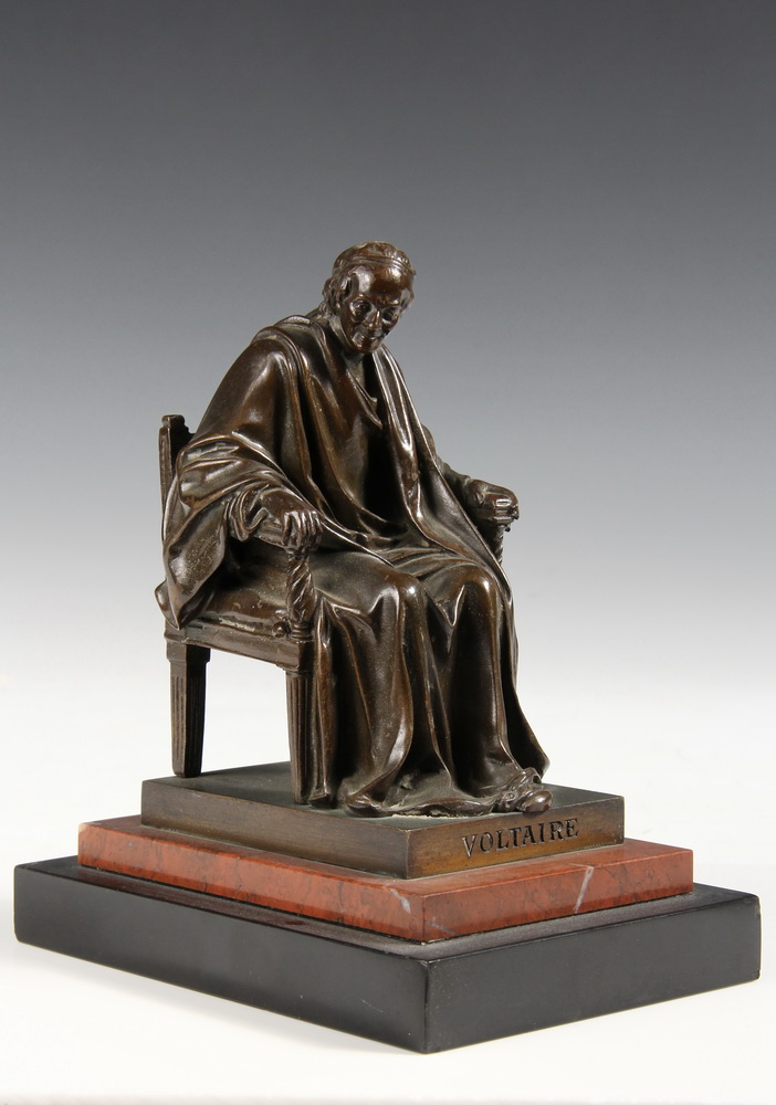 A BRONZE STATUETTE OF VOLTAIRE