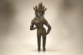A BRONZE 'TARA WITH ORCHID GES
