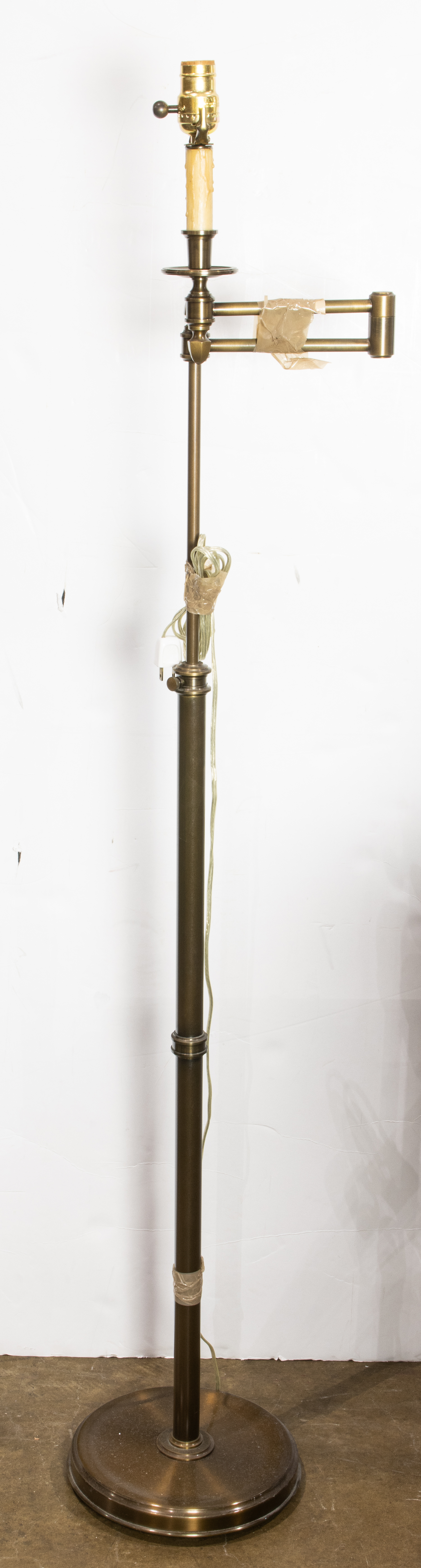 A BRONZED ADJUSTABLE FLOOR LAMP A
