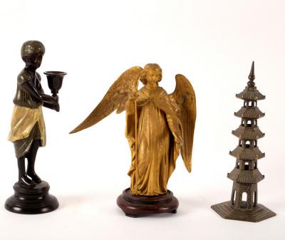 A bronzed metal candlestick