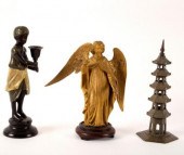 A bronzed metal candlestick fi