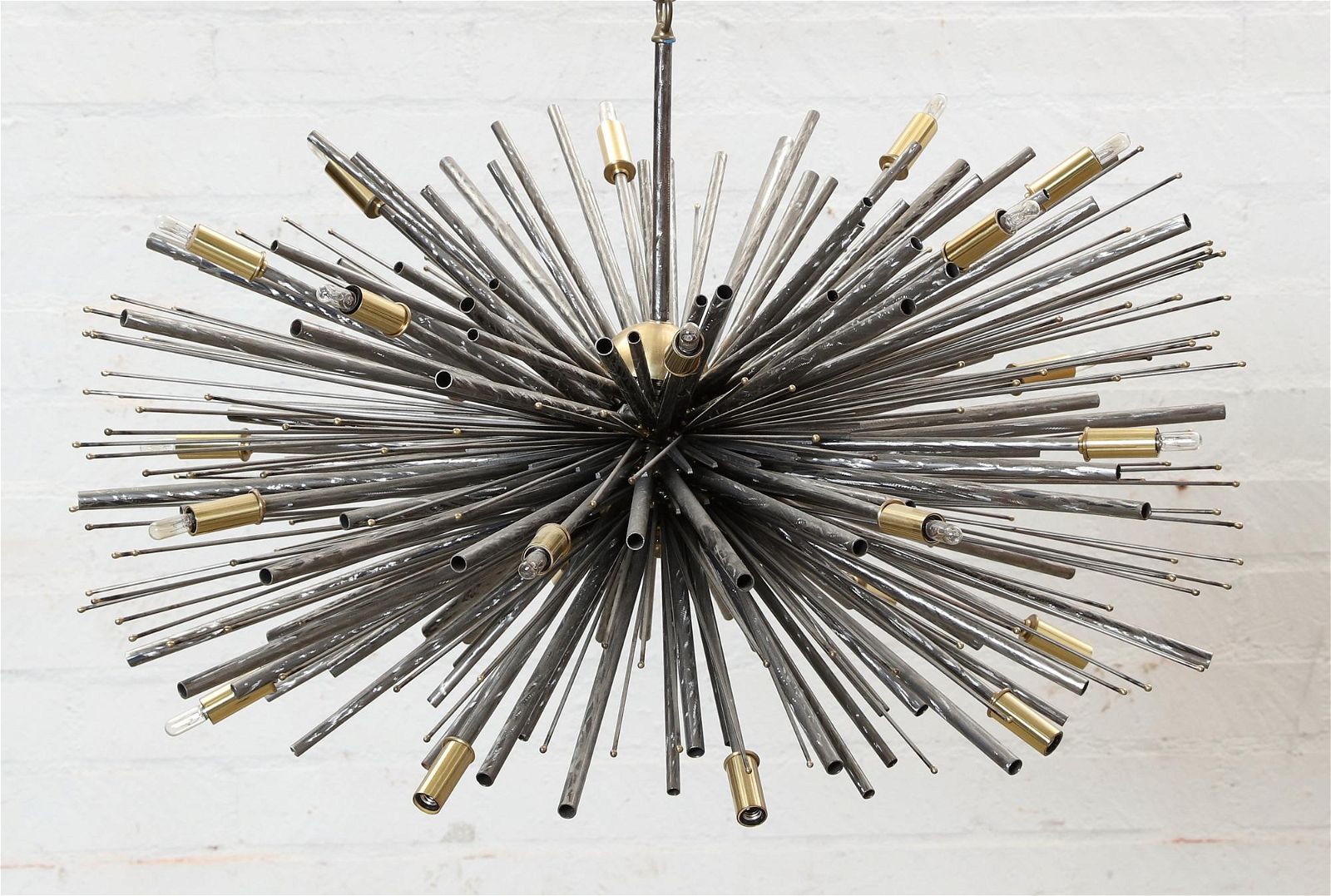 A BRUTALIST STEEL BURST PENDANT