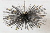 A BRUTALIST STEEL BURST PENDAN
