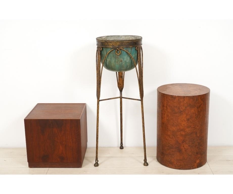A burl wood round plinth;
