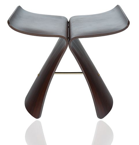 A BUTTERFLY STOOL IN THE STYLE OF