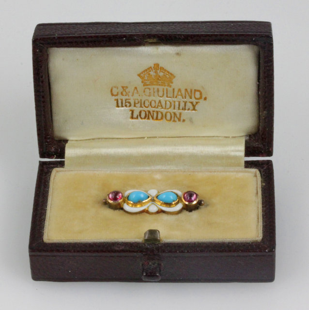 A C & A Giuliano baby's brooch