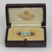 A C & A Giuliano baby's brooch