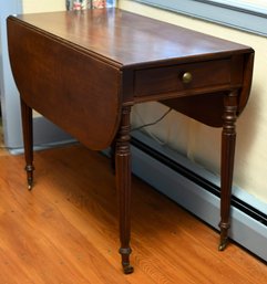 A ca. 1820 mahogany drop leaf table