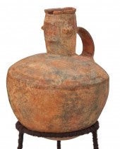 A CAPULI CERAMIC HANDLED VESSE