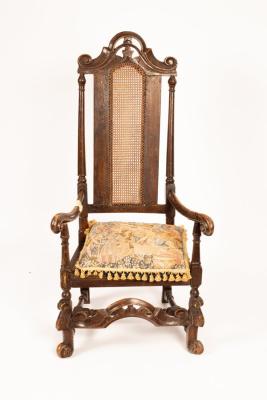 A Carolean oak armchair with cane