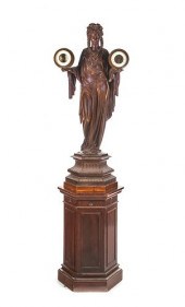 A CARRIER STATUE CLOCK AND BAR