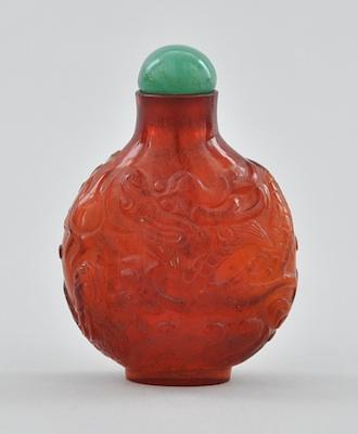 A Carved Amber Glass Snuff Bottle