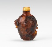 A Carved Amber Snuff Bottle Wi