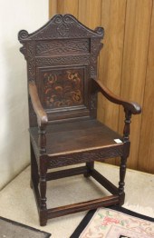 A CARVED AND INLAID WAINSCOT A
