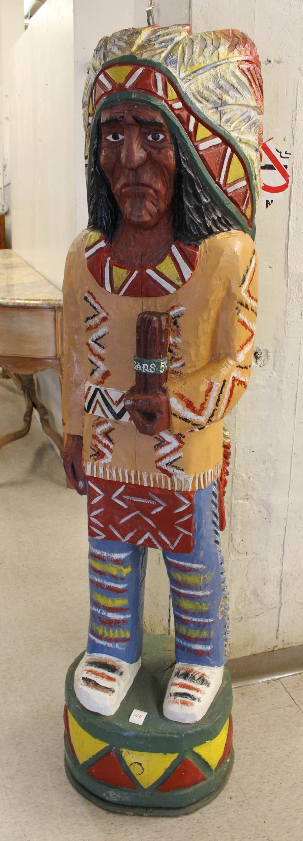 A CARVED AND PAINTED 'CIGAR