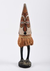 A carved and painted PNG spiri