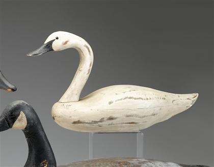 A carved and painted swan