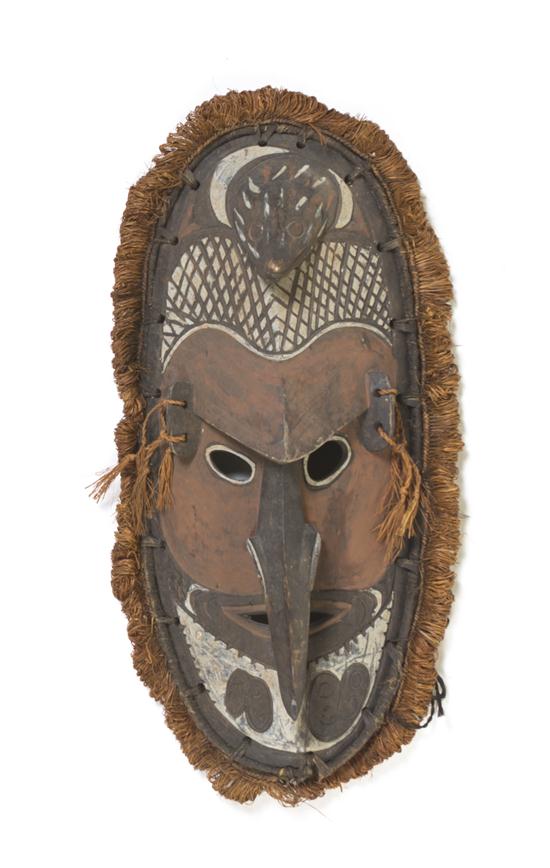 A Carved and Painted Wood Tiki Mask