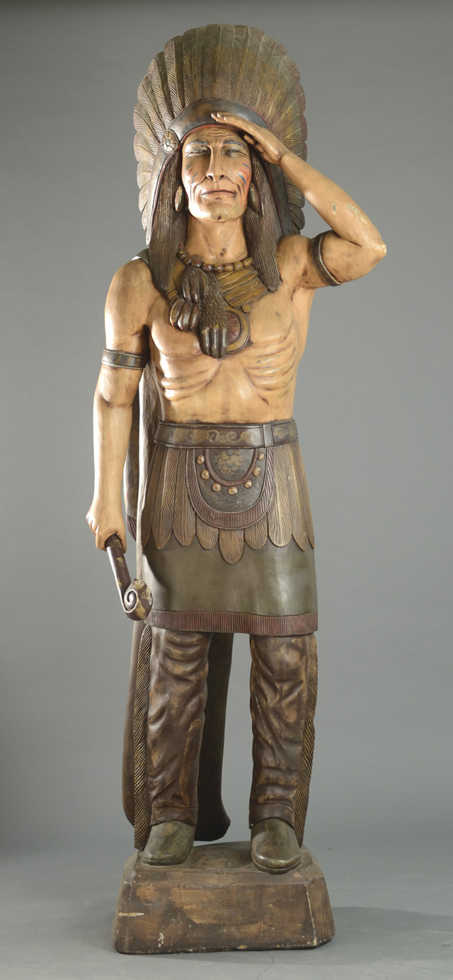 A CARVED AND PAINTED WOOD CIGAR