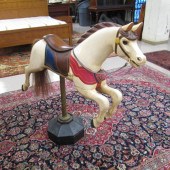 A CARVED AND PAINTED WOOD 'CAR