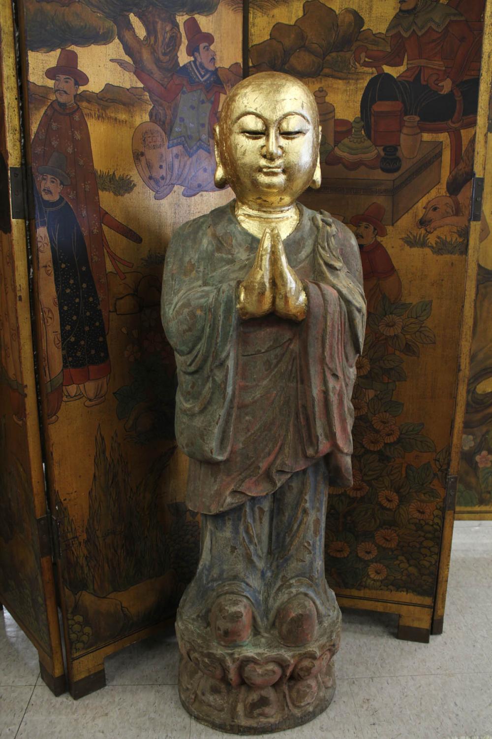 A CARVED AND PARCEL-GILDED WOOD