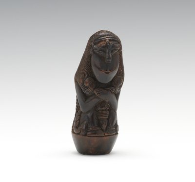 A Carved and Polished Wood Keris
