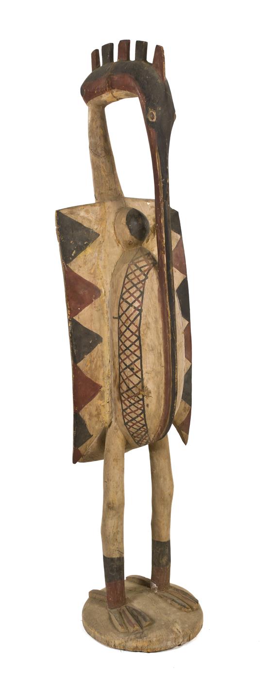 A Carved and Polychrome Decorated