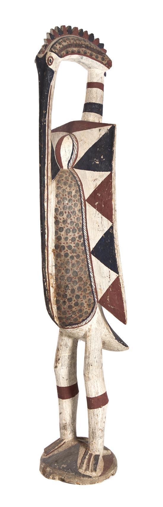 A Carved and Polychrome Decorated