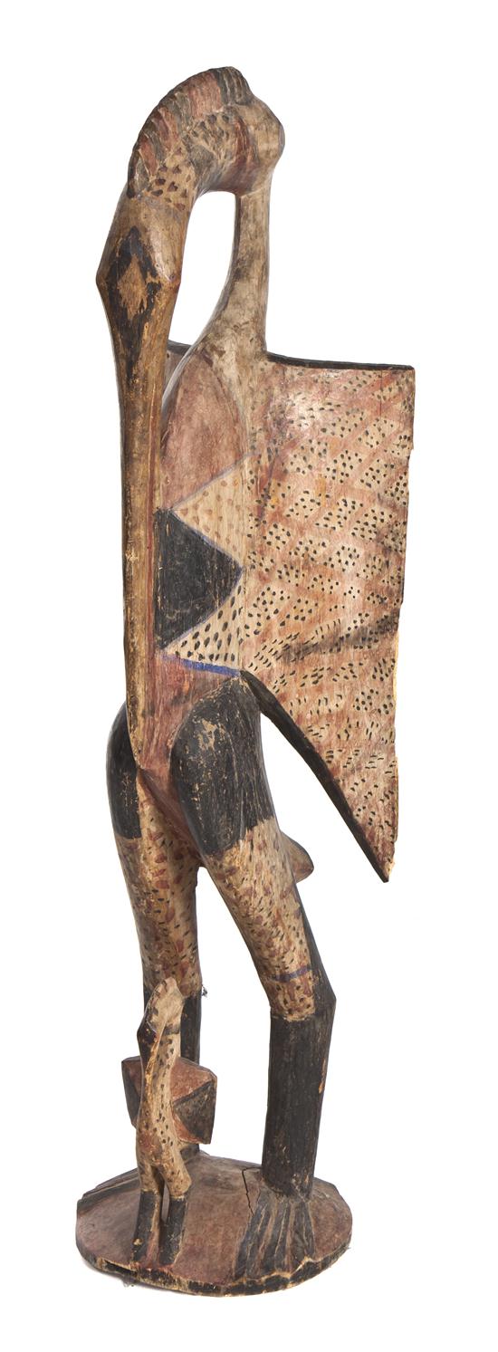 A Carved and Polychrome Decorated
