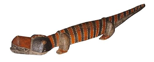 A CARVED AND POLYCHROMED AFRICAN