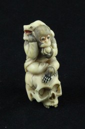A carved and stained ivory net